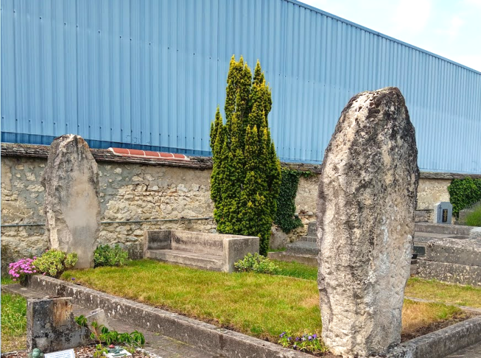 Completing their work of tending the gravesite with conscious attention, the Angove family provides the final watering.