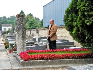 Many years previously, Mr. Patterson pays his essence gratitude and respect to Mr. Gurdjieff, the grave beautifully cared for and adorned with crimson begonias.