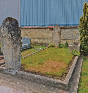 The family having offered their essence gratitude and respect, the grave is returned to ordered simplicity.